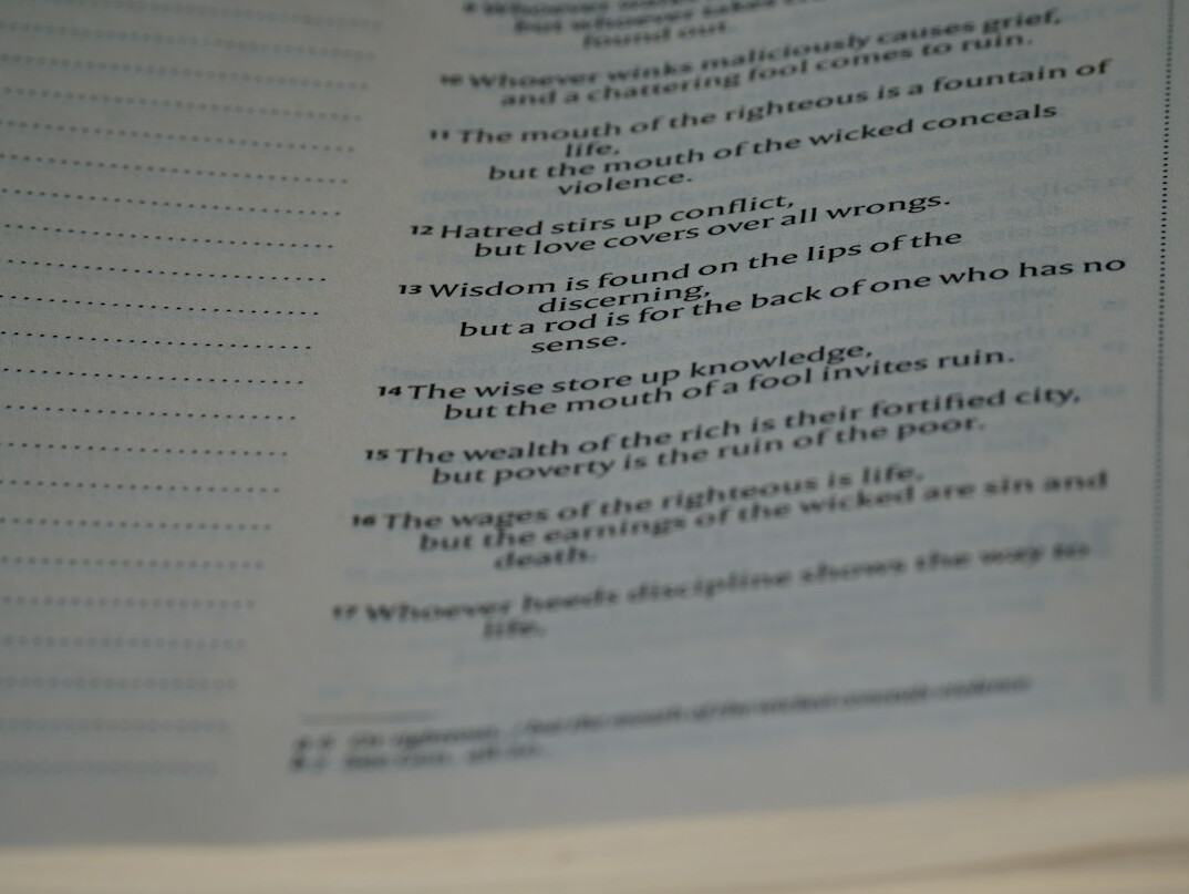 Close-up of printed financial statements and annual reports being cross-checked